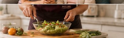 A caregiver preparing a fresh salad in a home kitchen